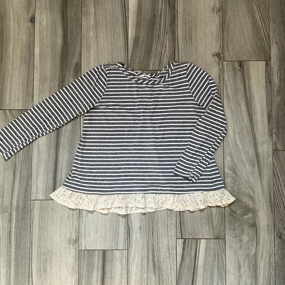 Women’s shirt with lace panel in back and around hem.